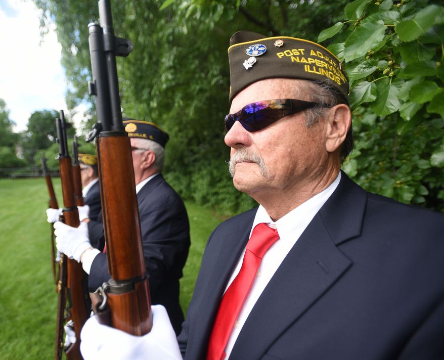 ADVANCE FOR USE SATURDAY, JUNE 25, 2016 AND THEREAFTER - In this June 7, 2016 photo, Lloyd McKee takes part in drills with Members of the Naperville VFW and American Legion honor guard in Naperville, Ill. They are certified to perform military funeral services for deceased veterans. The guard marched in its first Memorial Day parade this year and has performed services for eight burials.(Paul Michna/Daily Herald, via AP MANDATORY CREDIT; MAGS OUT; TV OUT