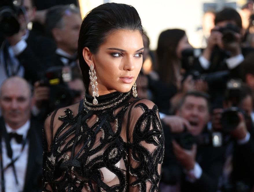 FILE - In this May 15, 2016, file photo, Kendall Jenner poses for photographers upon arrival at the screening of the film Mal De Pierres at the Cannes International Film Festival in southern France. Fashion designer shared a photo on Facebook June 22, 2016, of an advertisement featuring Jenner made up as what Jacobs calls a "goth goddess." (AP Photo/Joel Ryan, File)