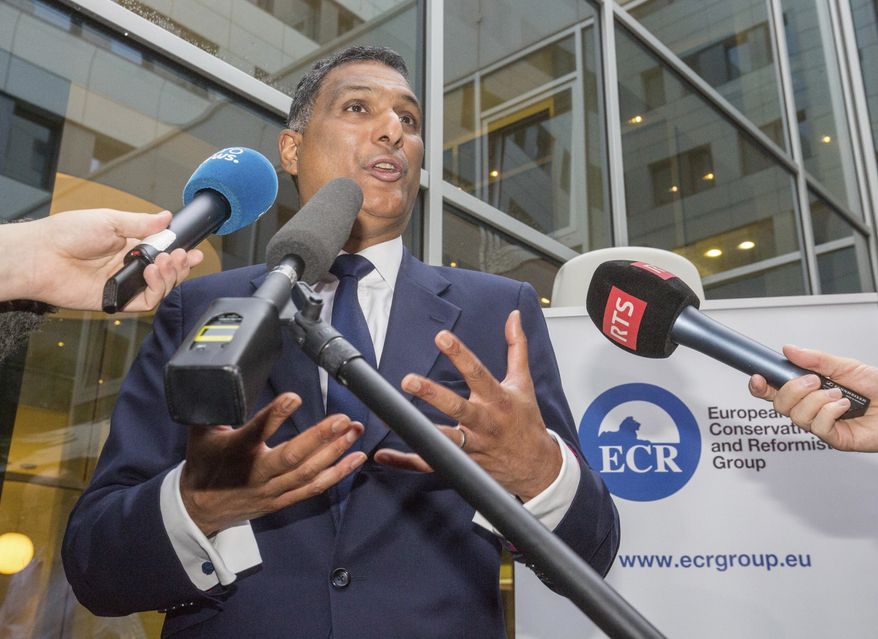 Leader of the European Conservatives and Reformists Syed Kamall speaks in Brussels on Friday, June 24, 2016. Britain entered uncharted waters Friday after the country voted to leave the European Union, according to a projection by all main U.K. broadcasters. (AP Photo/Olivier Matthys)