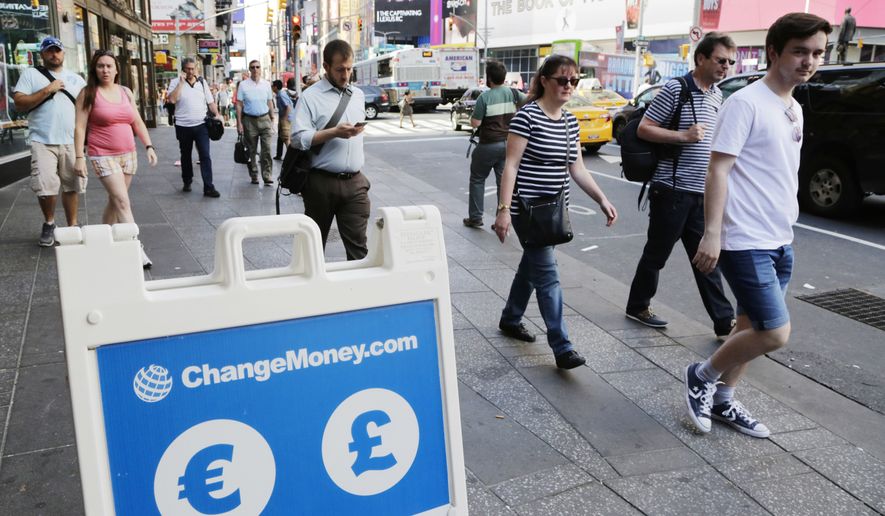 A signboard indicates that euros and pounds can be exchanged, Friday, June 24, 2016, at a money exchange in New York. Britain voted to leave the European Union after a bitterly divisive referendum campaign, toppling the government Friday, and sending global markets plunging. (AP Photo/Mark Lennihan)