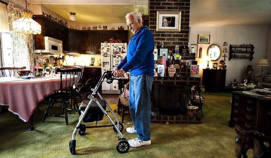 ADVANCE FOR RELEASE SATURDAY, JUNE 25, 2016, AT 3:01 A.M. EDT. AND THEREAFTER - In this May 10, 2016, photo, Polio survivor, Nick Hovemeyer stands in his home in Bristol, Pa. Hovemeyer had Polio when he was a boy, recovered then later in life his symptoms came back. (Rick Kintzel/Bucks County Courier Times via AP) MANDATORY CREDIT