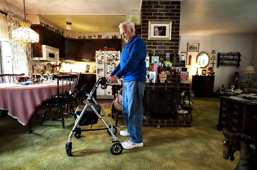 ADVANCE FOR RELEASE SATURDAY, JUNE 25, 2016, AT 3:01 A.M. EDT. AND THEREAFTER - In this May 10, 2016, photo, Polio survivor, Nick Hovemeyer stands in his home in Bristol, Pa. Hovemeyer had Polio when he was a boy, recovered then later in life his symptoms came back. (Rick Kintzel/Bucks County Courier Times via AP) MANDATORY CREDIT