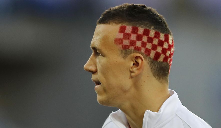 Croatia&#39;s Ivan Perisic sports the red and with checkerboard design of Croatia&#39;s flag, prior to the Euro 2016 round of 16 soccer match between Croatia and Portugal at the Bollaert stadium in Lens, France, Saturday, June 25, 2016. (AP Photo/Frank Augstein)