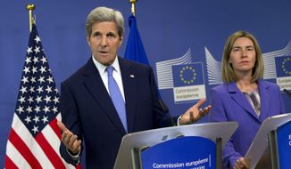 U.S. Secretary of State John Kerry, left, speaks during a media conference with European Union High Representative Federica Mogherini, right, at EU headquarters in Brussels on Monday, June 27, 2016. Kerry is on a one day trip to meet with NATO and EU officials. (AP Photo/Virginia Mayo)