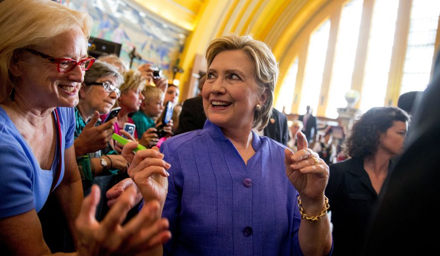 Democratic presidential candidate Hillary Clinton greets members of the audience following a rally at the Cincinnati Museum Center at Union Terminal in Cincinnati, Monday, June 27, 2016. (AP Photo/Andrew Harnik)