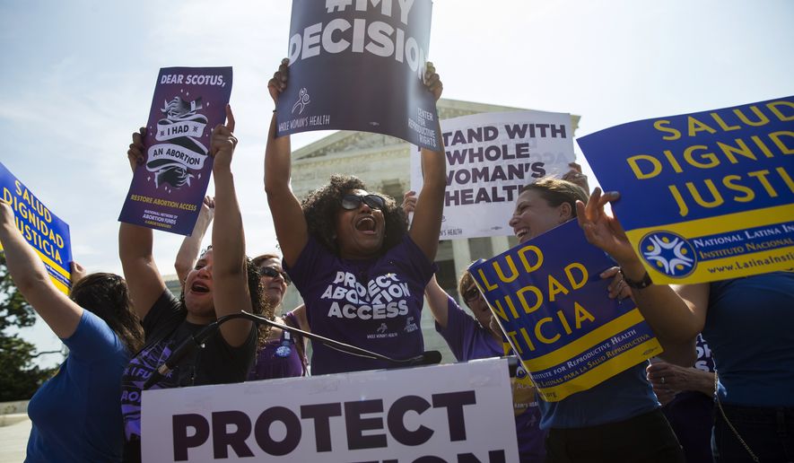 Pro-choice activists celebrate during a rally at the Supreme Court in Washington, Monday, June 27, 2016, after the court struck down Texas&#x27; widely replicated regulation of abortion clinics. The justices voted 5-3 in favor of Texas clinics that had argued the regulations were a thinly veiled attempt to make it harder for women to get an abortion in the nation&#x27;s second-most populous state. (AP Photo/Evan Vucci)