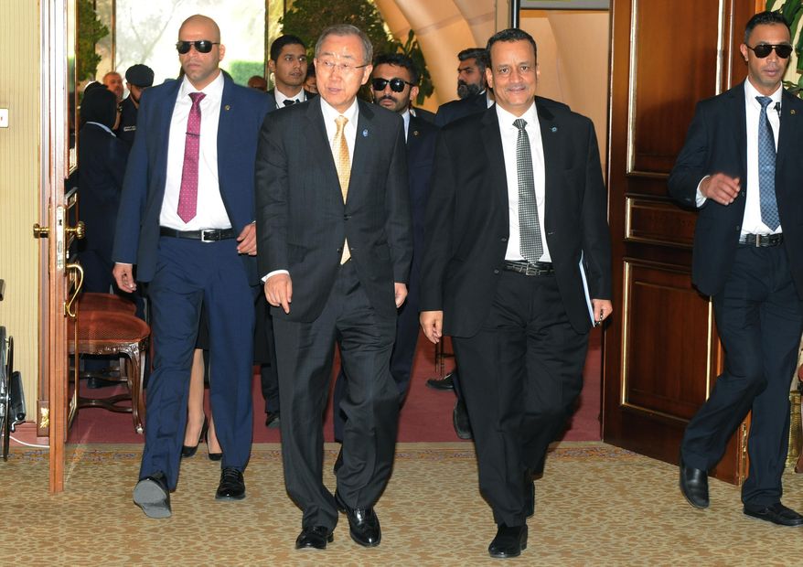 In this Sunday, June 26, 2016 photo released by the Kuwait Ministry of Information and made available Monday, June 27, U.N. Secretary-General Ban Ki-moon, second left, arrives for the Yemeni Peace Talks with Yemeni delegations in Kuwait. Ban urged Yemen's warring factions to keep working toward a comprehensive agreement, warning that "time is not on the side of the Yemeni people," in remarks Sunday to delegates taking part in peace talks that began in Kuwait two months ago. (Kuwait Ministry of Information via AP)