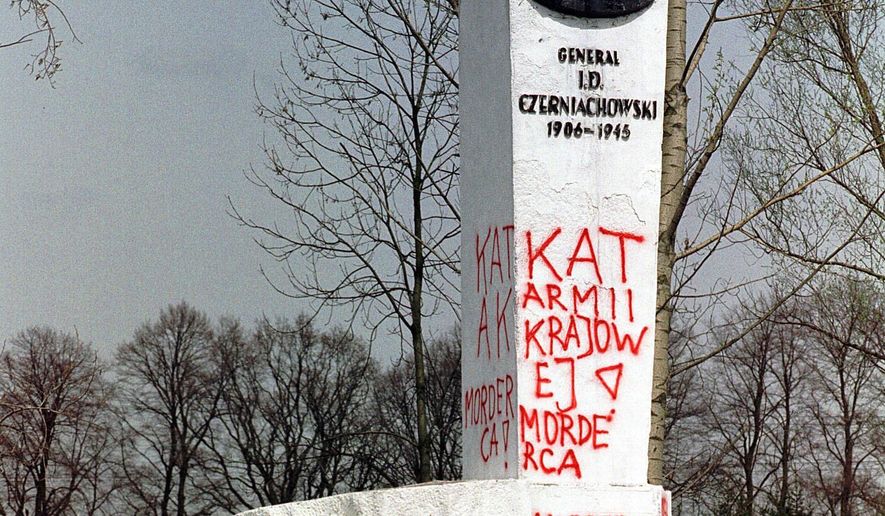 FILE - In this April 30, 2001 file photo taken in Pieniezno, Poland, graffiti with insults like &amp;quot;Murderer&amp;quot; and &amp;quot;Shame&amp;quot; can be seen on a memorial to Soviet General Ivan Chernyakhovsky, who is considered a symbol of the imposition of communism in Poland, but a national hero in Russia. Polish authorities are planning to move more than 200 communist-era monuments to Soviet troops into a former Red Army base to testify to a historic “untruth.” Pawel Ukielski, deputy head of the state Institute of National Remembrance, or IPN, said that the plan covers structures put up in the 1940s and ‘50s to glorify the Red Army’s march through Poland at the end of World War II as it was defeating the Nazi Germans.(AP Photo/Wojtek Jakubowski, File) POLAND OUT