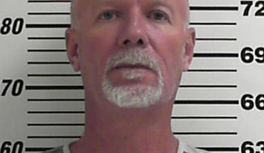 FILE - This image provided by the Davis County Sheriff shows Flint Wayne Harrison. Flint Wayne Harrison and his son, Dereck James "DJ" Harrison, on the run from police after tying up five women in a Utah basement, abducted and killed a rail line worker, Wyoming prosecutors said Tuesday, June 28, 2016. The Lincoln County Attorney's Office charged Flint Wayne Harrison and his son, Dereck James "DJ" Harrison, with first-degree murder and kidnapping in the death of Kay Porter Ricks. (Davis County Sheriff via AP, File)