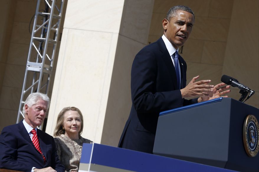 Former President Bill Clinton and his wife, former first lady and former Secretary of State Hillary Rodham Clinton, listen as President Barack Obama speaks at the dedication of the George W. Bush presidential library on the campus of Southern Methodist University in Dallas on April 25, 2013. (Associated Press) **FILE**