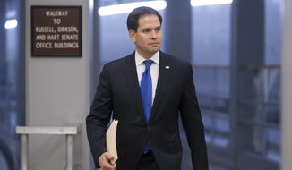Sen. Marco Rubio, Florida Republican, heads to the Senate chamber on Capitol Hill in Washington on June 29, 2016, as a rescue package for debt-stricken Puerto Rico survived a critical procedural test vote, just two days before the island is expected to default on a $2 billion debt payment. (Associated Press) **FILE**