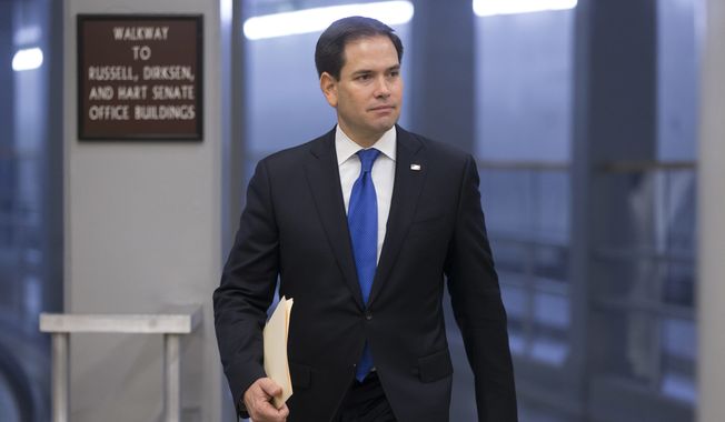 Sen. Marco Rubio, Florida Republican, heads to the Senate chamber on Capitol Hill in Washington on June 29, 2016, as a rescue package for debt-stricken Puerto Rico survived a critical procedural test vote, just two days before the island is expected to default on a $2 billion debt payment. (Associated Press) **FILE**