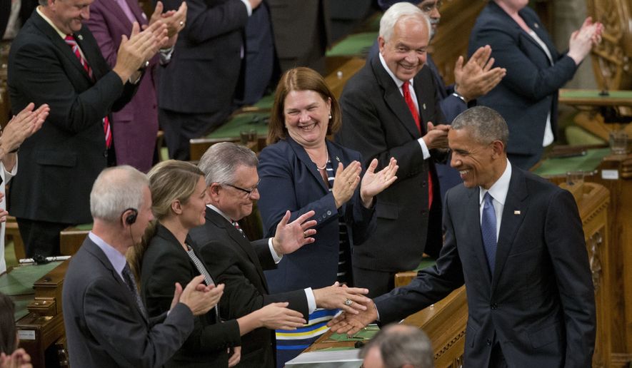 President Barack Obama, right, shakes hands before addressing the Canadian Parliament in the House of Commons in Ottawa, Canada, Wednesday, June 29, 2016. (AP Photo/Pablo Martinez Monsivais)