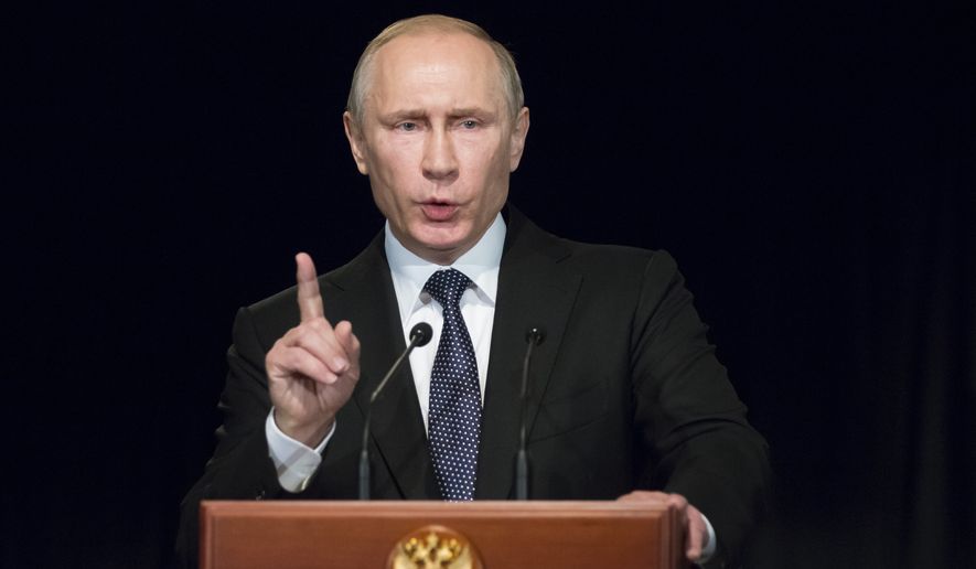 Russian President Vladimir Putin gestures as he addresses students during his visit to German Embassy school in Moscow, Russia, Wednesday, June 29, 2016.  Putin has offered his condolences to Turkey which was hit by suicide attacks on Tuesday, killing dozens at Istanbul&#x27;s airport. (AP Photo/Alexander Zemlianichenko, pool)