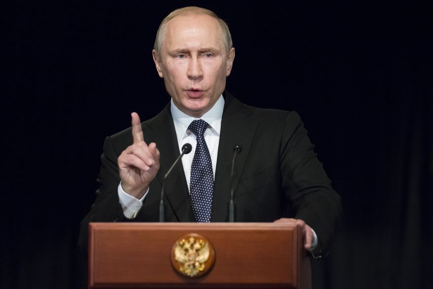 Russian President Vladimir Putin gestures as he addresses students during his visit to German Embassy school in Moscow, Russia, Wednesday, June 29, 2016.  Putin has offered his condolences to Turkey which was hit by suicide attacks on Tuesday, killing dozens at Istanbul&#x27;s airport. (AP Photo/Alexander Zemlianichenko, pool)