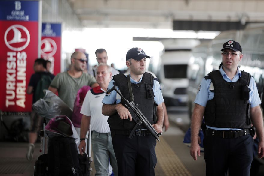 Turkish police officers patrol outside Istanbul's Ataturk airport, Wednesday, June 29, 2016. Suicide attackers killed dozens and wounded scores of others at Istanbul's busy Ataturk Airport late Tuesday, the latest in a series of bombings to strike Turkey in recent months. Turkish authorities have banned distribution of images relating to the Ataturk airport attack within Turkey. (AP Photo/Lefteris Pitarakis)