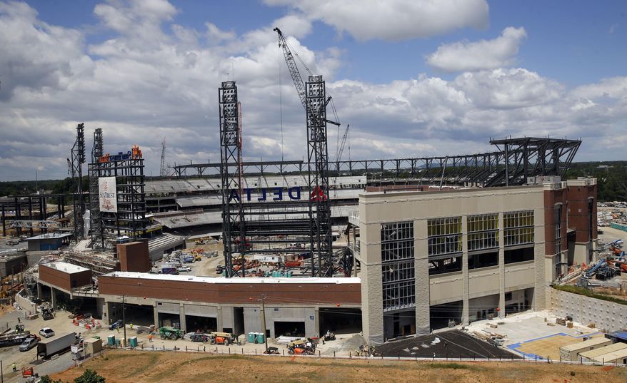 FILE- In this May 5, 2016, file photo, work continues on SunTrust Park, the future home of the Atlanta Braves baseball team in Atlanta. The Braves are scheduled to open SunTrust Park in April 2017, according to a copy of the team's preliminary schedule obtained by The Associated Press. (AP Photo/John Bazemore, File)