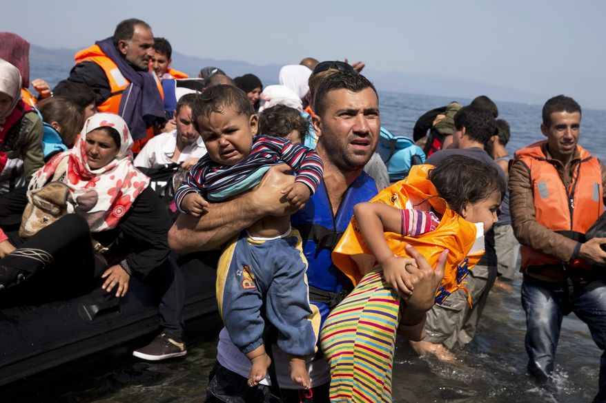 Syrian refugees arrive aboard a dinghy after crossing from Turkey to the island of Lesbos, Greece, on Sept. 10, 2015. (Associated Press)
