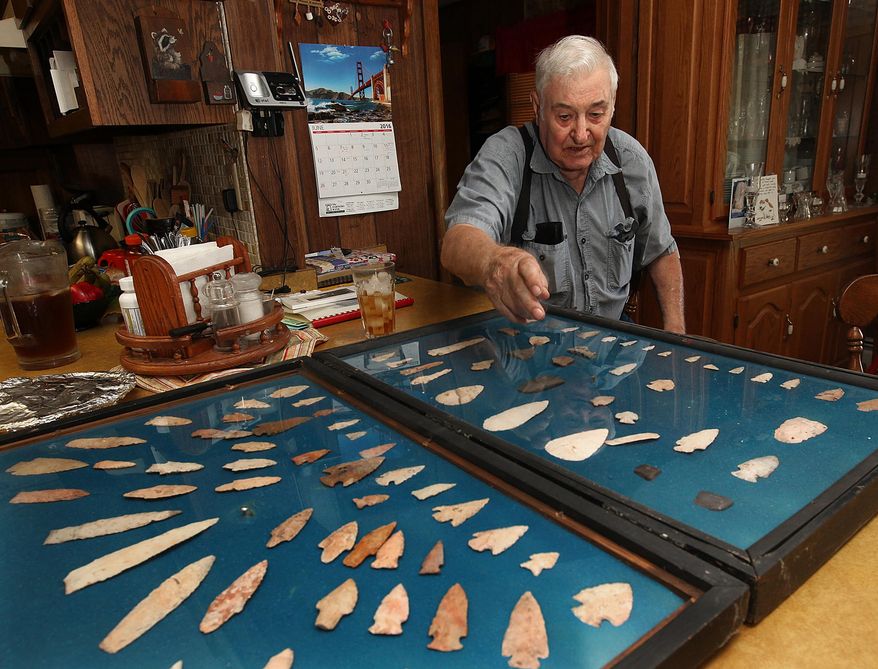 ADVANCE FOR USE SUNDAY JULY 3, 2016 AND THERE AFTER - In this June 7, 2016 photo, longtime arrowhead collector Eddie Johnson points out various aspects of his collection in his rural Pike County, Ill., home. Johnson has been collecting arrowheads since he was a young boy. (Phil Carlson/The Quincy Herald-Whig via AP) MANDATORY CREDIT