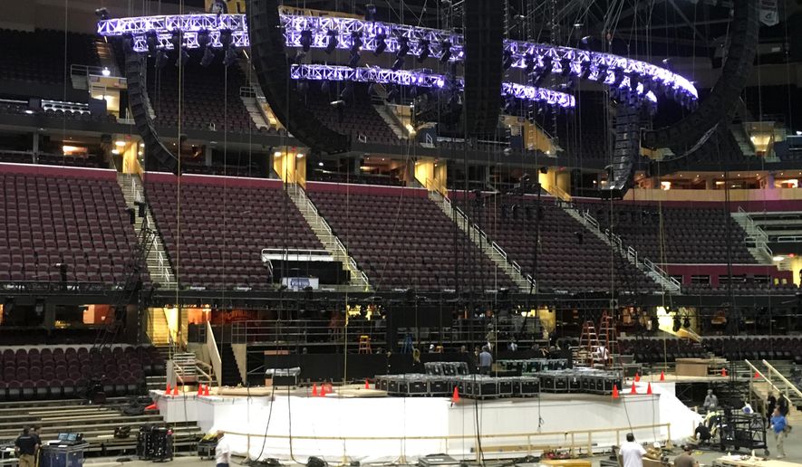 FILE - In this June 28, 2016 file photo, work continues on the main stage for the Republican National Convention in Cleveland. (AP Photo/Mark Gillispie)