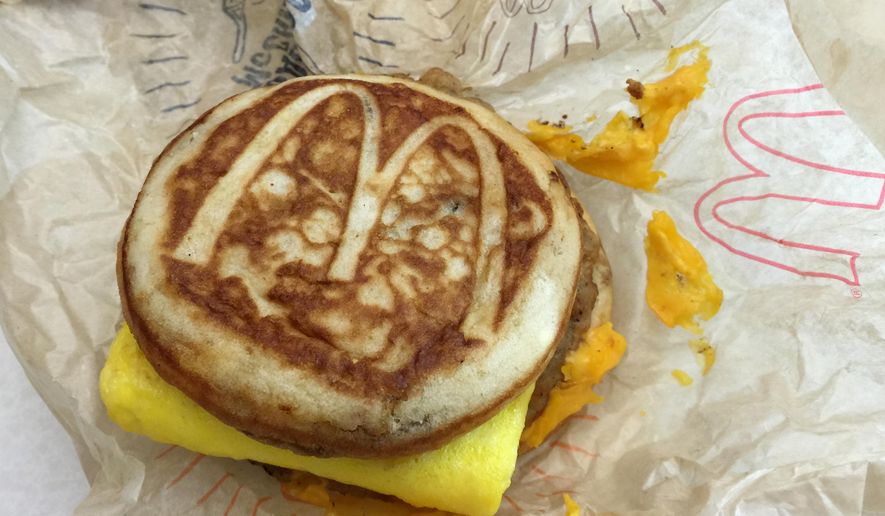 This file photo shows a McDonald's McGriddle sandwich in New York on Jan. 28, 2016. McDonald's says it will expand its all-day breakfast menu with the addition of McGriddles nationally starting in late August. The company is hoping to continue momentum from the launch of a limited all-day breakfast menu from 2015 as it tries to revive slumping sales. (Associated Press) **FILE**