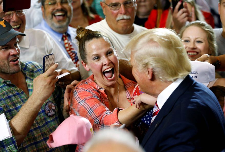 Fans encounter Donald Trump at a recent rally in Ohio, though a recent poll finds many voters are not satisfied with their choices for president. (Associated Press)