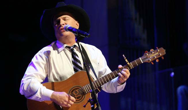 Garth Brooks performs at The Country Music Hall of Fame 2015 Medallion Ceremony at Country Music Hall of Fame and Museum in Nashville, Tenn., in this Oct. 25, 2015 file photo. Brooks announced Thursday, July 7, 2016,  that The Garth Channel on SiriusXM, will debut Sept. 8 and will feature songs from his albums, live recordings and commentary from the best-selling singer. (Photo by Laura Roberts/Invision/AP) **FILE**