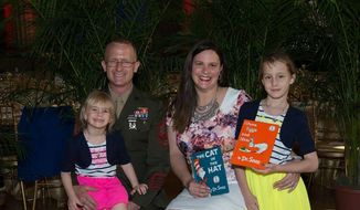 The Harth family (from left, Alexandra Harth, 5, Marines Corps. Sgt. Patrick Harth, 35, Natasha Harth, 34, and Justice Harth, 9) attended United Through Reading&#39;s Tribute to Military Families in Washington D.C on May 25, 2016. (Photo by United Through Reading).