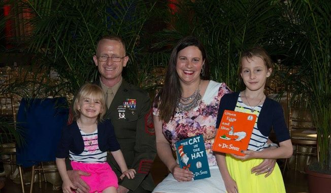 The Harth family (from left, Alexandra Harth, 5, Marines Corps. Sgt. Patrick Harth, 35, Natasha Harth, 34, and Justice Harth, 9) attended United Through Reading&#x27;s Tribute to Military Families in Washington D.C on May 25, 2016. (Photo by United Through Reading).