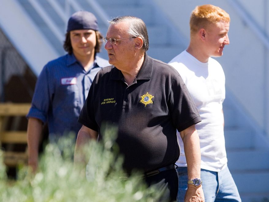 FILE - In this May 6, 2010, file photo, Maricopa County Sheriff Joe Arpaio talks with workers after an immigration raid on a business in Phoenix. Lawyers challenging identity theft laws that were used to charge hundreds of immigrants in Arizona are asking a judge to sanction Arpaio's Office for a sergeant's destruction of notes from his discussions with prosecutors about enforcing the statutes, Thursday, July 7, 2016. (Michael Schennum/The Arizona Republic via AP) MARICOPA COUNTY OUT; MAGS OUT; NO SALES; MANDATORY CREDIT