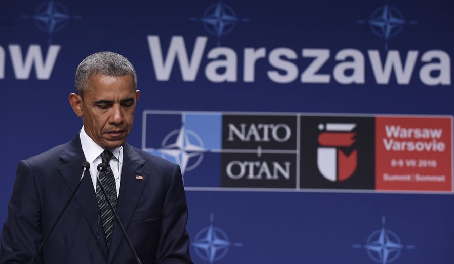 President Barack Obama listens to Polish President Andrzej Duda offering condolences before making statements following their meeting at PGE National Stadium in Warsaw, Poland, Friday, July 8, 2016. Obama is in Warsaw to attend the NATO Summit. (AP Photo/Susan Walsh)