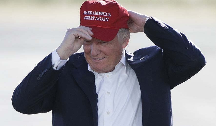 Republican presidential candidate Donald Trump wears his &quot;Make America Great Again&quot; hat at a rally in Sacramento, Calif., June 1, 2016. (Associated Press) ** FILE **
