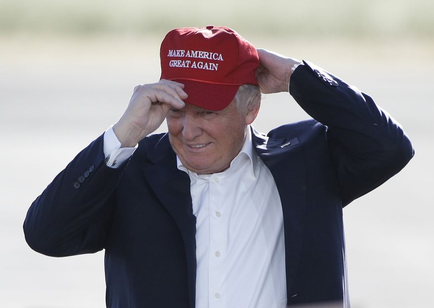 Republican presidential candidate Donald Trump wears his &quot;Make America Great Again&quot; hat at a rally in Sacramento, Calif., June 1, 2016. (Associated Press) ** FILE **