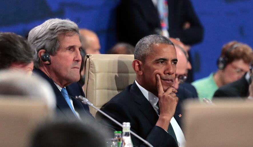 President Barack Obama waits next to State Secretary John Kerry for the start of the first working session of the North Atlantic Council at the NATO summit in Warsaw, Poland, Friday, July 8, 2016. Starting Friday, US President Barack Obama and leaders of the 27 other NATO countries will take decisions in Warsaw on how to deal with a resurgent Russia, violent extremist organizations like Islamic State, attacks in cyberspace and other menaces to allies&#x27; security during a summit described by many observers as NATO&#x27;s most crucial meeting since the 1989 fall of the Berlin Wall.(AP Photo/Markus Schreiber)
