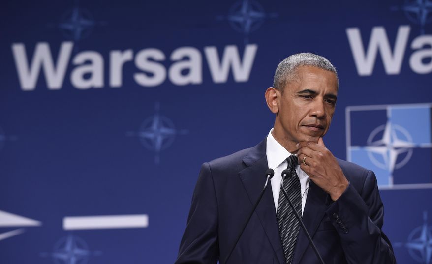 President Barack Obama listens as Polish President Andrzej Duda makes a statement following their meeting at PGE National Stadium in Warsaw, Poland, Friday, July 8, 2016. Obama is in Warsaw to attend the NATO Summit. (AP Photo/Susan Walsh)