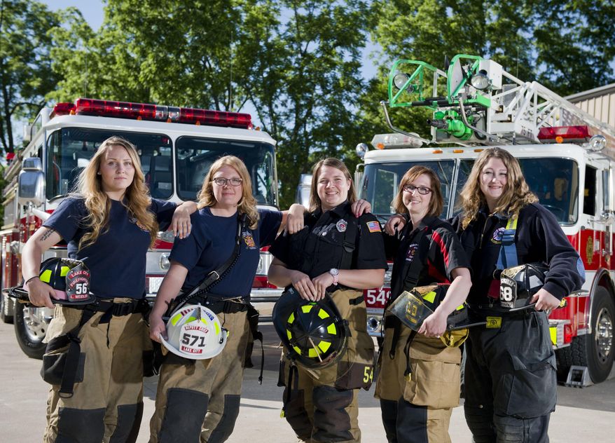 ADVANCE FOR SATURDAY JULY 9 AND THEREAFTER - In a June 14, 2016 photo, a group of west county volunteer firefighters poses for a picture, including, from left: Lindsay Weidler of Girard, rookie Lake City Fire Company firefighter and EMT; Jennifer Waxham of Lake City, deputy chief of EMS at Lake City Fire Company; Kim Hyde of Girard, EMS lieutenant at Girard's A. F. Dobler Hose & Ladder Company; Stephanie Fox of Waterford, a captain of Waterford's Stancliff Hose Company; and Emma Blasius of Millcreek Township, a firefighter and EMT at Millcreek Township's Kuhl Hose Company, at the Dobler fire station in Girard, Pa. (AP Photo/Erie Times-News, Andy Colwell)