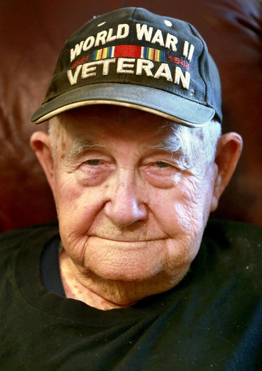 ADVANCE FOR MONDAY JULY 11 - In this June 7, 2016 Robert Elliott, 93, a U.S. Army veteran from World War II, poses at his home in Nain, Va. in Nain, Va. After joining the Army in 1942 at 19 years old, Robert Elliott didn’t follow the typical soldier’s path during World War II. Now 93, Elliott found himself not with a rifle, but instead breaking pack horses in the Australian outback. (Ginger Perry/The Winchester Star via AP) MANDATORY CREDIT