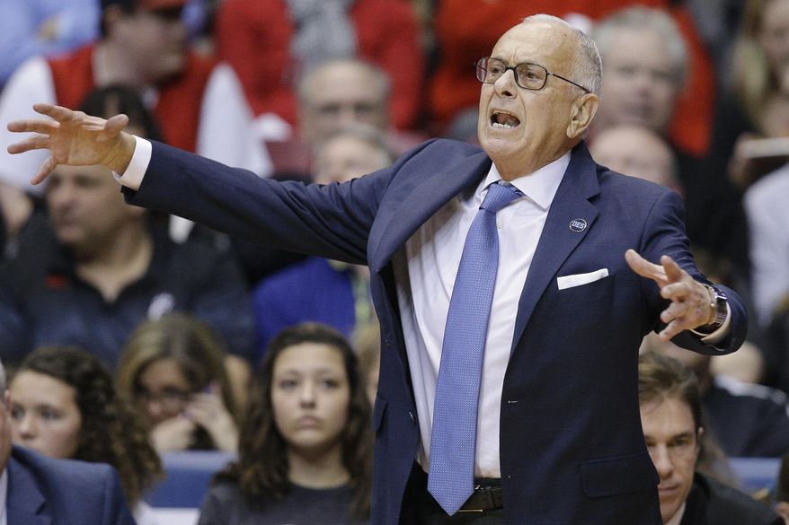 FILE - In this March 6, 2016, file photo, SMU head coach Larry Brown works the sideline during the first half of an NCAA college basketball game against Cincinnati, in Cincinnati. Larry Brown says he is resigning as SMU's basketball coach, ending a four-year run during which the Mustangs made the NCAA Tournament for the first time since 1993 and then were banned from postseason play last season. (AP Photo/John Minchillo, File)