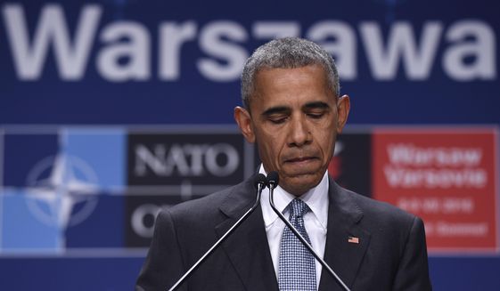 President Barack Obama pauses while speaking about the events in Dallas at the beginning of his news conference at PGE National Stadium in Warsaw, Poland, Saturday, July 9, 2016. Obama is in Warsaw attending the NATO Summit. (AP Photo/Susan Walsh)