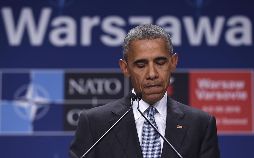 President Barack Obama pauses while speaking about the events in Dallas at the beginning of his news conference at PGE National Stadium in Warsaw, Poland, Saturday, July 9, 2016. Obama is in Warsaw attending the NATO Summit. (AP Photo/Susan Walsh)