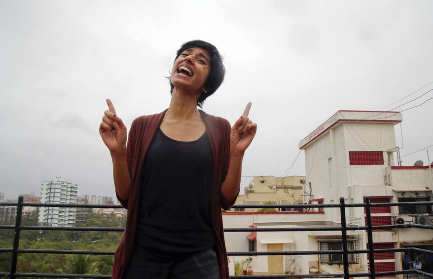 In this June 25, 2016 photo, Indian rapper Sofia Ashraf demonstrates her skills in Mumbai, India. The South Indian rapper is targeting Dow Chemical with rhymes - demanding the U.S. company pay more in victims' compensation and environmental damages stemming from a horrific chemical gas leak that killed thousands of people and sickened countless others.(AP Photo/ Rajanish Kakade)