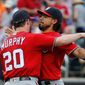 The Washington Nationals&#39; Daniel Murphy and third baseman Anthony Rendon have reason to celebrate heading into the all-star break with a six-game lead in the NL East. (Associated Press Photographs)