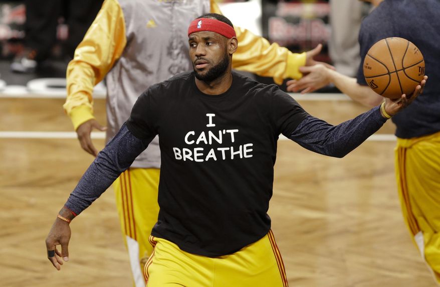 Cleveland Cavaliers' LeBron James wears a T-shirt reading "I Can't Breathe" during warms up before an NBA basketball game against the Brooklyn Nets in New York, Dec. 8, 2014. (Associated Press) ** FILE **