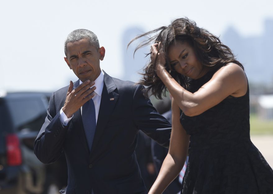 President Barack Obama and first lady Michelle Obama arrive via Air Force One at Dallas Love Field in Dallas, Tuesday, July 12, 2016. Obama will speak at an interfaith memorial service for the fallen police officers and members of the Dallas community at the Morton H. Meyerson Symphony Center in Dallas. (AP Photo/Susan Walsh)