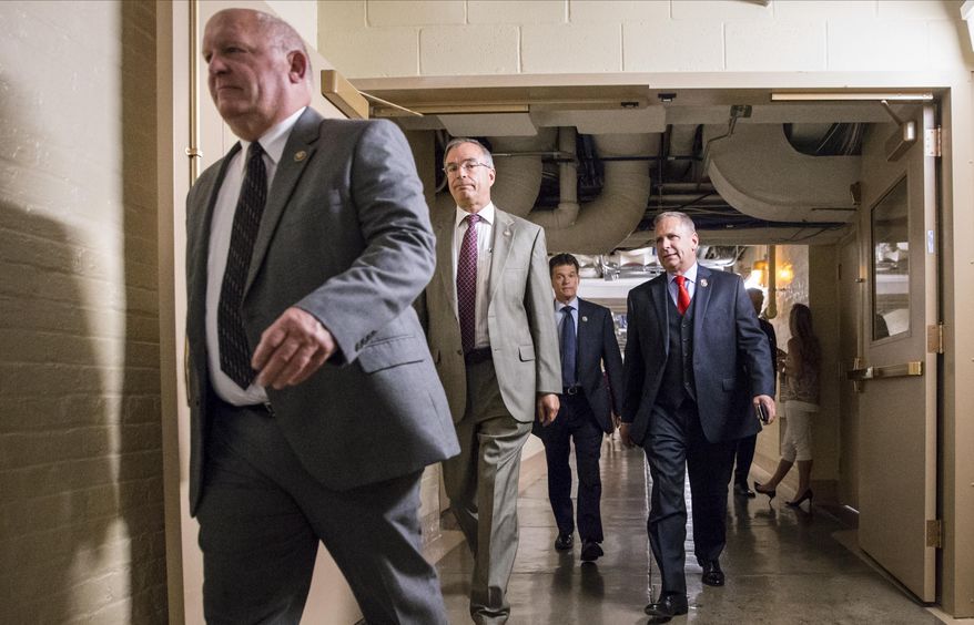 House Republicans rush to a closed-door GOP caucus with House Speaker Paul Ryan of Wis., on Capitol Hill in Washington, Tuesday, July 12, 2016.Congress is expected to exit Washington for a months-long recess with no action on gun control, despite mass shootings in recent weeks and uproar from Democrats who have pushed for new legislation. (AP Photo/J. Scott Applewhite)