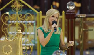 Televangelist Paula White in a 2014 photo from her eponymous website. Accessed July 12, 2016. [https://www.paulawhite.org/images/image-gallery/ghana-dec2014/AT3A9705.jpg]