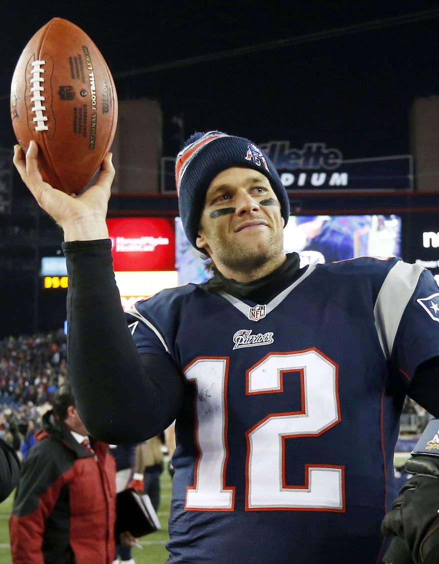FILE - In this Jan. 10, 2015, file photo, New England Patriots quarterback Tom Brady holds up the game ball after an NFL divisional playoff football game against the Baltimore Ravens in Foxborough, Mass. On Wednesday, July 13, 2016, a federal appeals court has rejected Tom Brady's attempt to get a new hearing on his suspension. Brady was asking for the full 2nd U.S. Circuit Court of Appeals to hear the case. In April, a three-judge panel said that NFL commissioner Roger Goodell was within his powers when he suspended the star quarterback four games for his role in a scheme to doctor the footballs used in a Jan. 18, 2015, playoff game. (AP Photo/Elise Amendola, File)