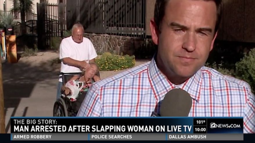 Randall Burgess, 60, was arrested after he was seen slapping a woman in a wheelchair in the background a live TV news broadcast. (KPNX)