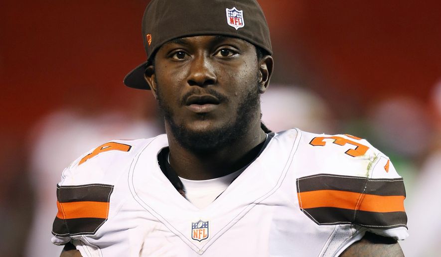 FILE - In this Aug. 13, 2015, file photo, Cleveland Browns running back Isaiah Crowell (34) is shown during an NFL preseason football game against the Washington Redskins in Cleveland. Crowell says he will donate about $35,000 to a fallen officers' fund in Dallas as part of his apology for posting a drawing on Instagram last week showing a police officer getting his throat slashed. In a video posted on Facebook Wednesday, July 13, 2016, Crowell again apologized for the posting and said he would donate his first game check to a fund for the police officers slain and injured during a sniper attack last week. (AP Photo/Ron Schwane, File)