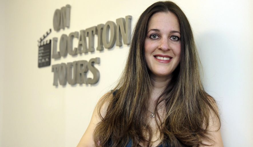 In this Thursday, July 7, 2016, photo, Georgette Blau, owner of On Location Tours, poses for photos at her office in New York. Britain’s vote to leave the European Union has many U.S. small and medium-sized companies in limbo because they do business in the U.K. or other countries nearby. On Location Tours in New York, which specializes in outings to places where TV shows like “Sex and the City” and “Gossip Girl” were shot, usually gets nearly a third of its business from Britons visiting the U.S. (AP Photo/Richard Drew)